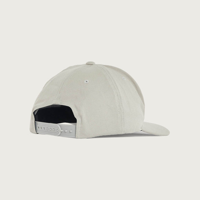 Model wears Motion Golfer Cap Dove Headwear in White - Image 2
