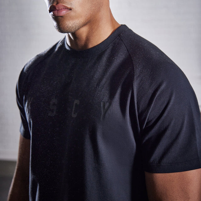 Model wears Process Raglan Curved Hem T-Shirt Jet Black T-Shirts in Black - Image 2