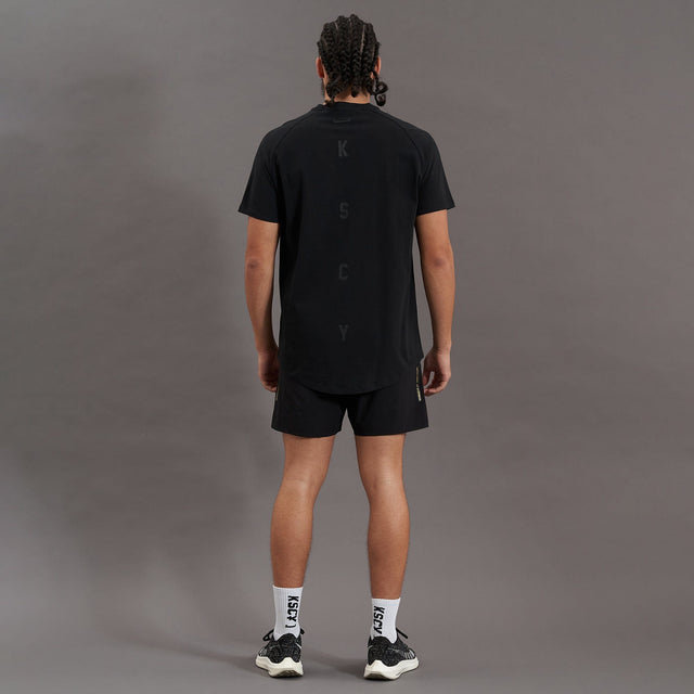 Model wears Process Raglan Curved Hem T-Shirt Jet Black T-Shirts in Black - Image 10