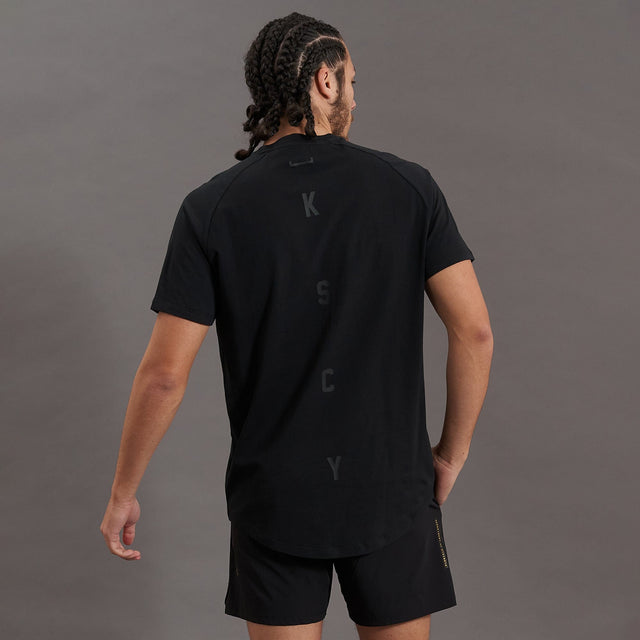 Model wears Process Raglan Curved Hem T-Shirt Jet Black T-Shirts in Black - Image 8