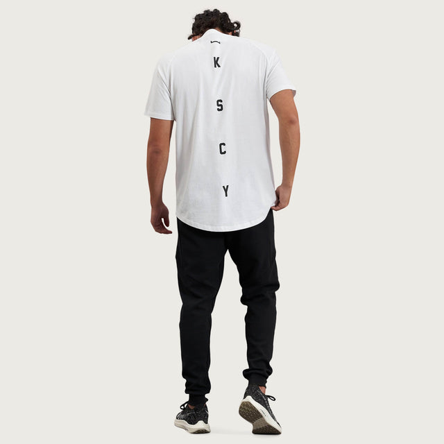 Model wears Process Raglan Curved Hem T-Shirt White T-Shirts in White - Image 9