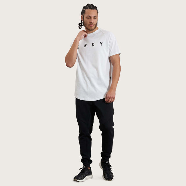 Model wears Process Raglan Curved Hem T-Shirt White T-Shirts in White - Image 11