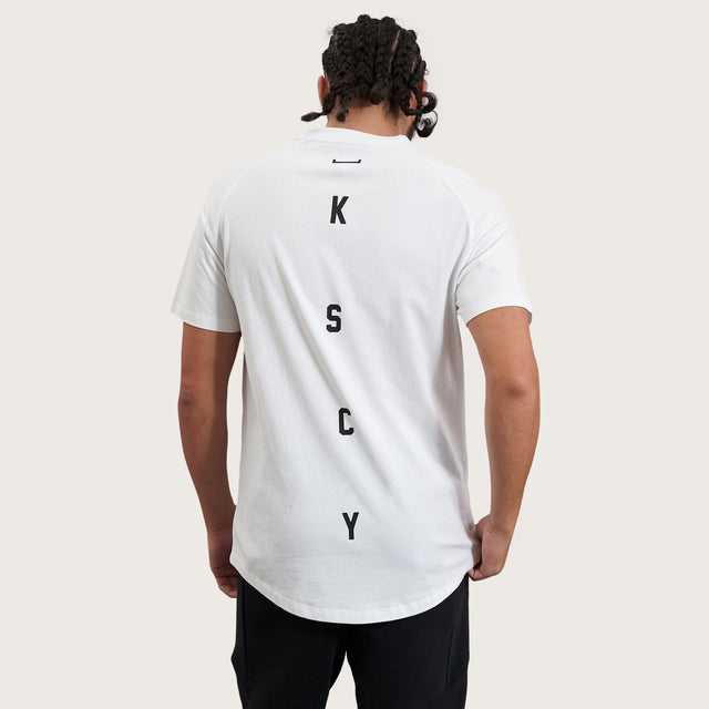 Model wears Process Raglan Curved Hem T-Shirt White T-Shirts in White - Image 1