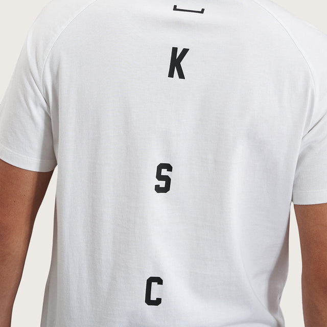 Model wears Process Raglan Curved Hem T-Shirt White T-Shirts in White - Image 10