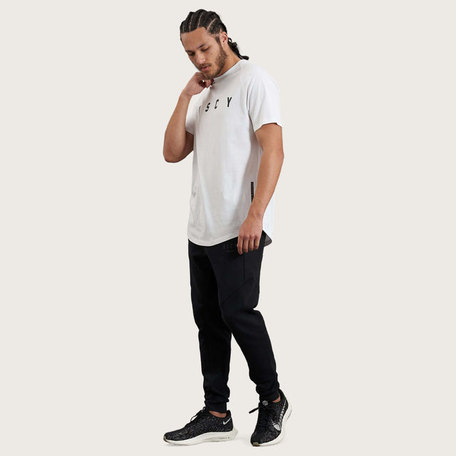 Model wears Process Raglan Curved Hem T-Shirt White T-Shirts in White - Image 7
