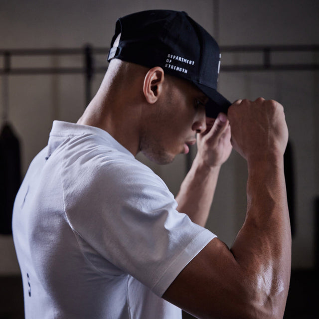 Model wears Process Raglan Curved Hem T-Shirt White T-Shirts in White - Image 8