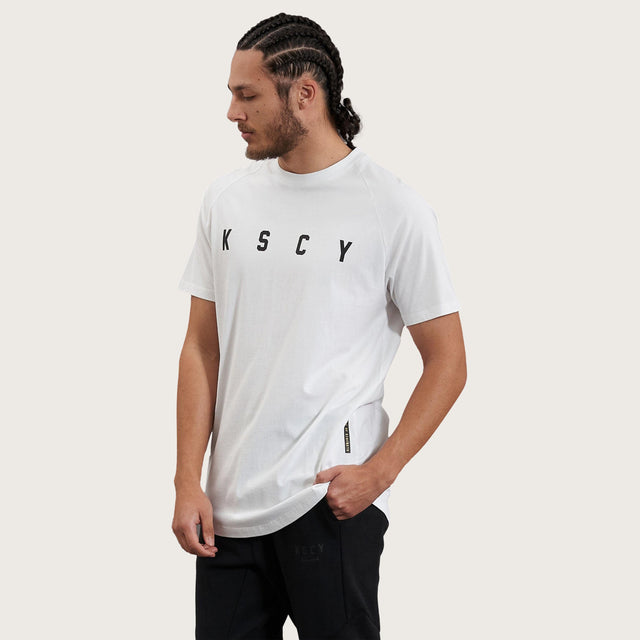 Model wears Process Raglan Curved Hem T-Shirt White T-Shirts in White - Image 4