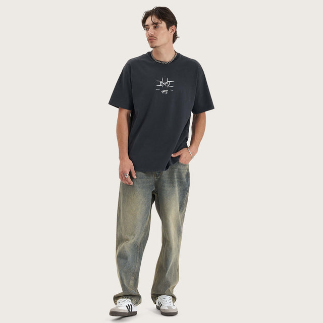 Model wears Revival Heavy Box Fit Tee Pigment Vulcan T-Shirts in Grey - Image 4