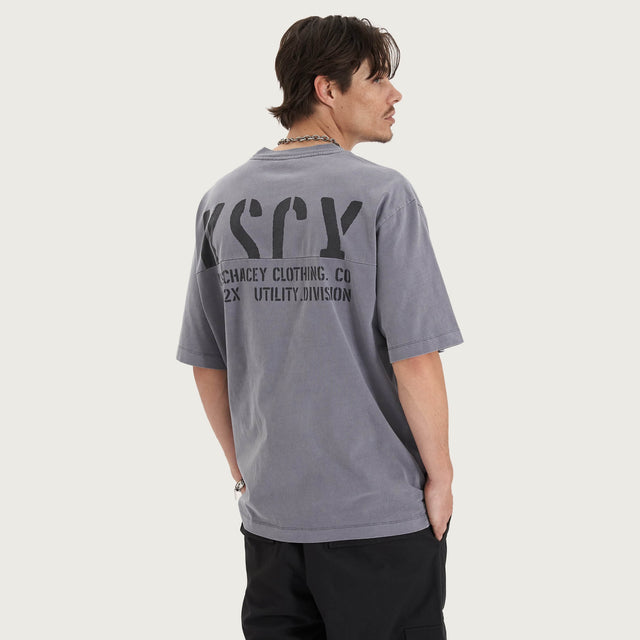 Model wears Schism Heavy Oversized Tee Pigment Steel T-Shirts in Grey - Image 1