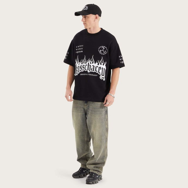 Model wears System Loopback Street Tee Jet Black T-Shirts in Black - Image 9