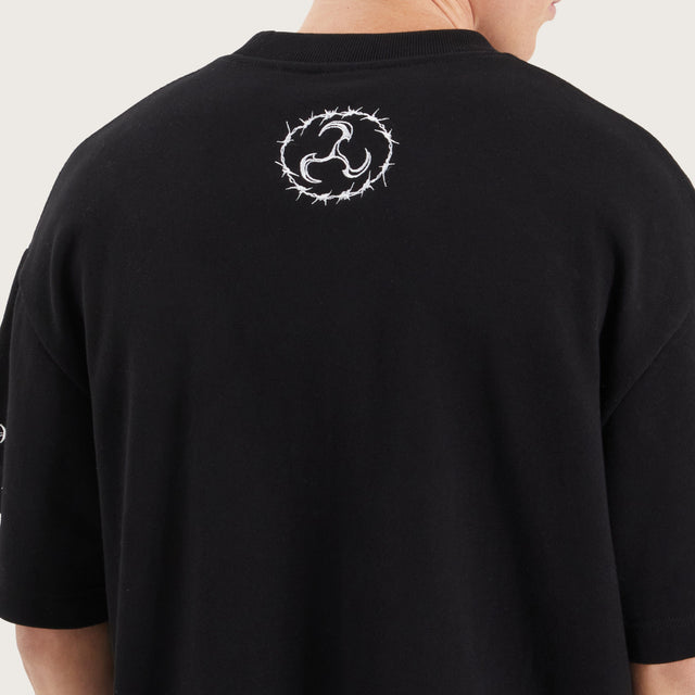 Model wears System Loopback Street Tee Jet Black T-Shirts in Black - Image 6