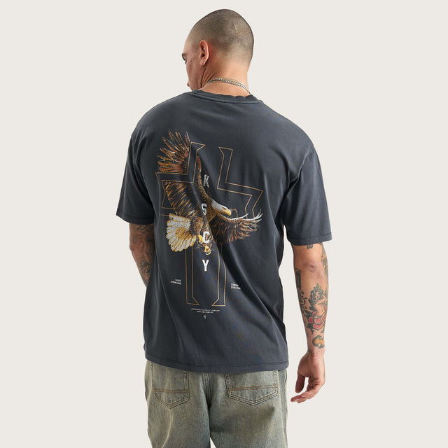 Model wears The Knight Heavy Box Fit Tee Pigment Black T-Shirts in Black - Image 1