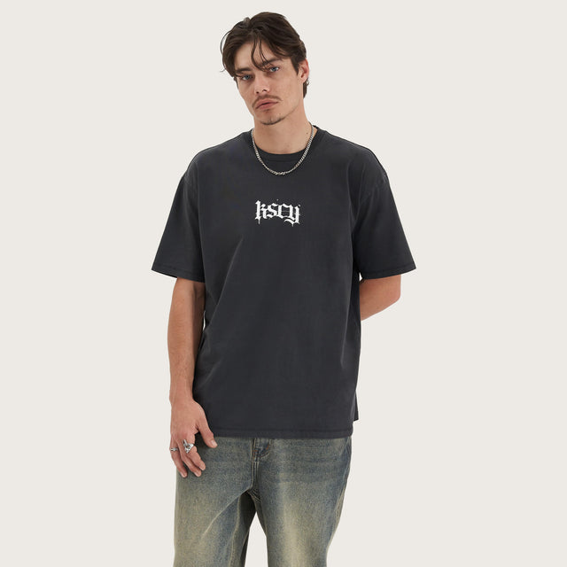 Model wears Tin Petal Heavy Box Fit Tee Pigment Black T-Shirts in Black - Image 2