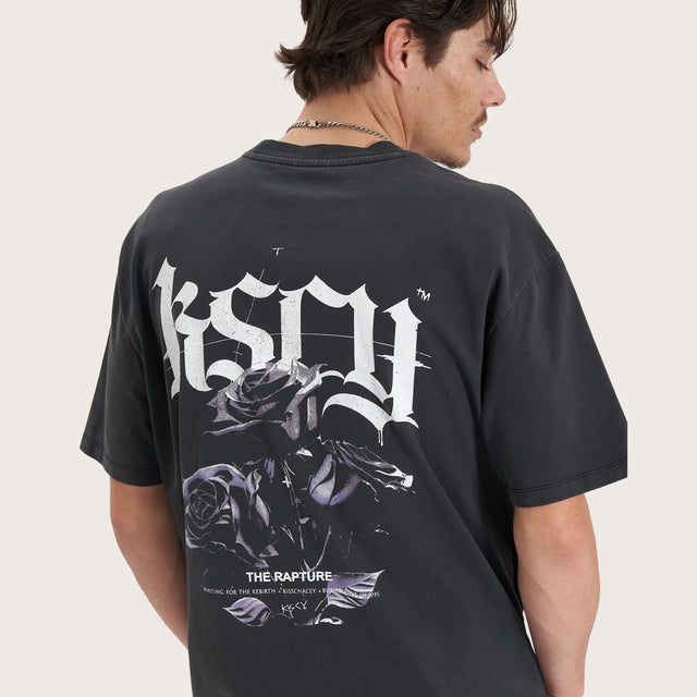 Model wears Tin Petal Heavy Box Fit Tee Pigment Black T-Shirts in Black - Image 5