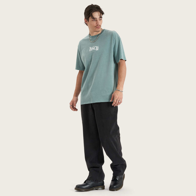 Model wears Tin Petal Heavy Box Fit Tee Pigment Trellis T-Shirts in Green - Image 5