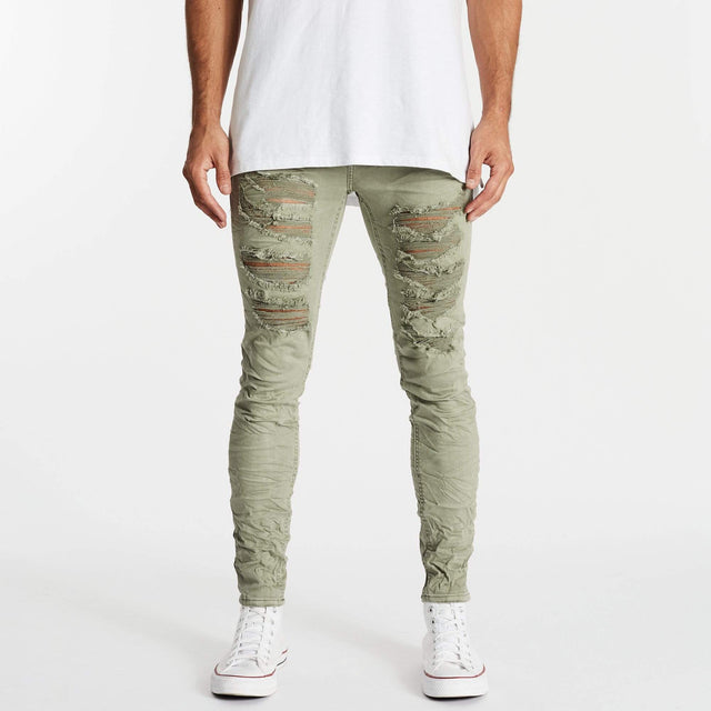Model wears K1 Super Skinny Jeans Destroyed Lichen Green Pants in Green - Image 1