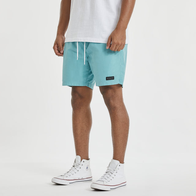 Model wears Sunrise Beach Short Turquoise Shorts in Blue - Image 5
