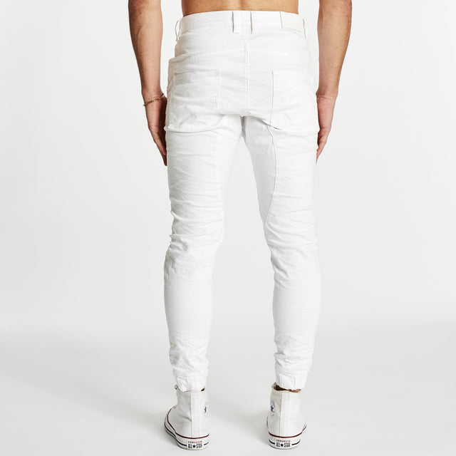 Model wears Zeppelin Pants White Pants in White - Image 6