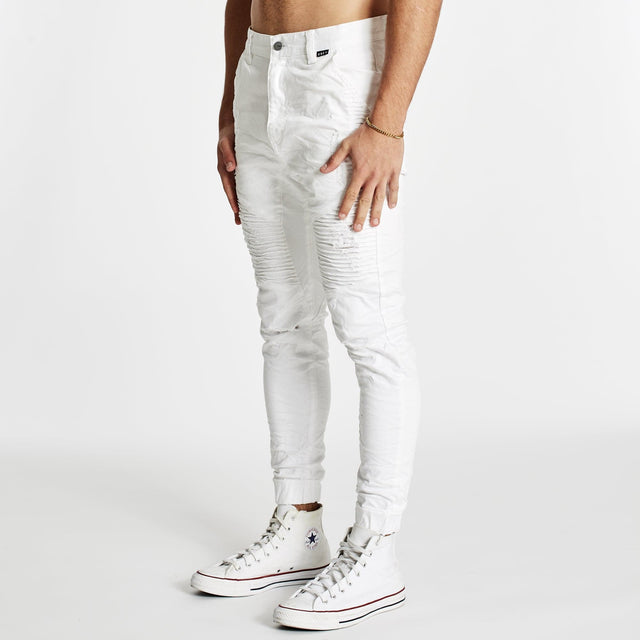 Model wears Zeppelin Pants White Pants in White - Image 5