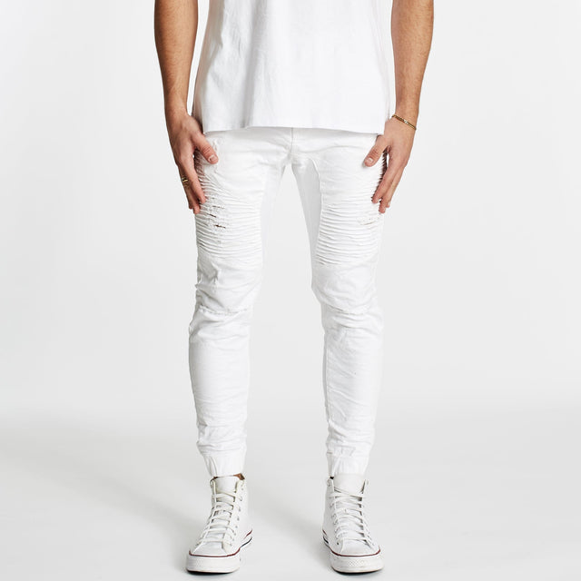 Model wears Zeppelin Pants White Pants in White - Image 1