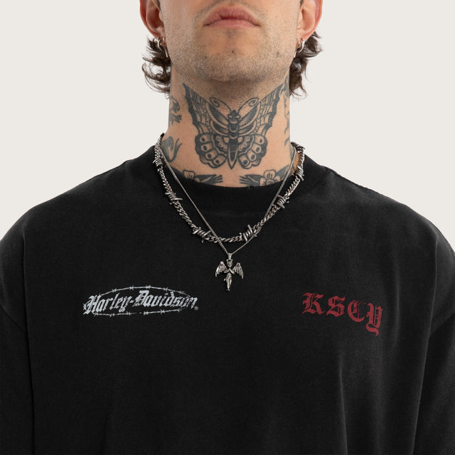 Model wears Instake Street Tee Snow Black T-Shirts Black – image 2