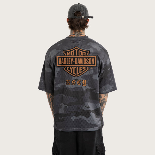 Model wears Merge Gridiron Jersey Camo Jerseys Brown – image 2
