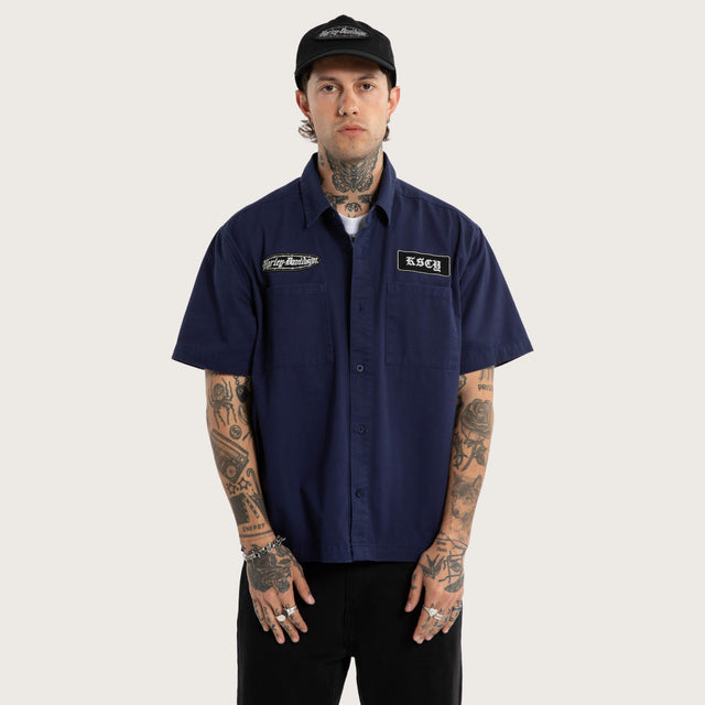Model wears Refuel SS Mechanic Shirt Patriot Blue Short Sleeve Shirts Blue – image 1