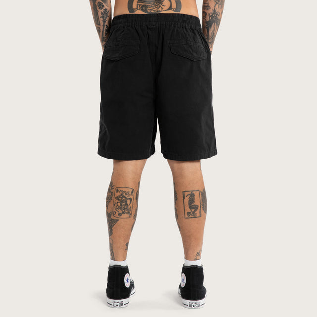Model wears Mosh Baggy Short 2.0 Jet Black Shorts Black – image 4