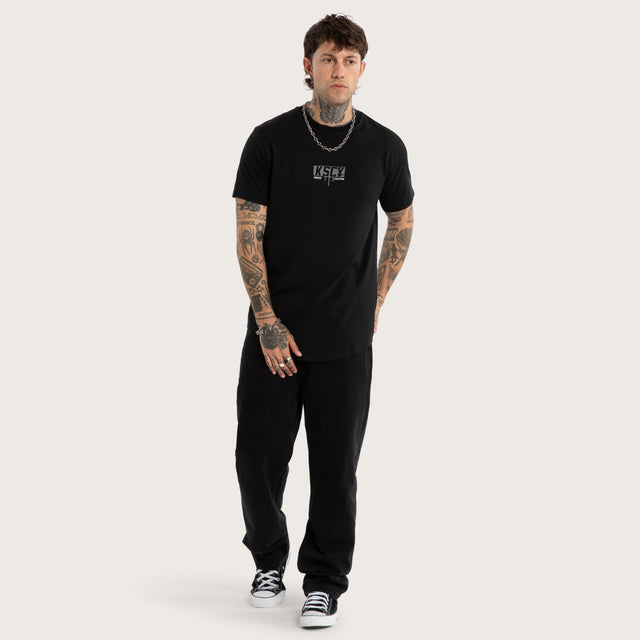 Model wears Dream Dual Curved Tee Jet Black/Castle Rock T-Shirts Black – image 5
