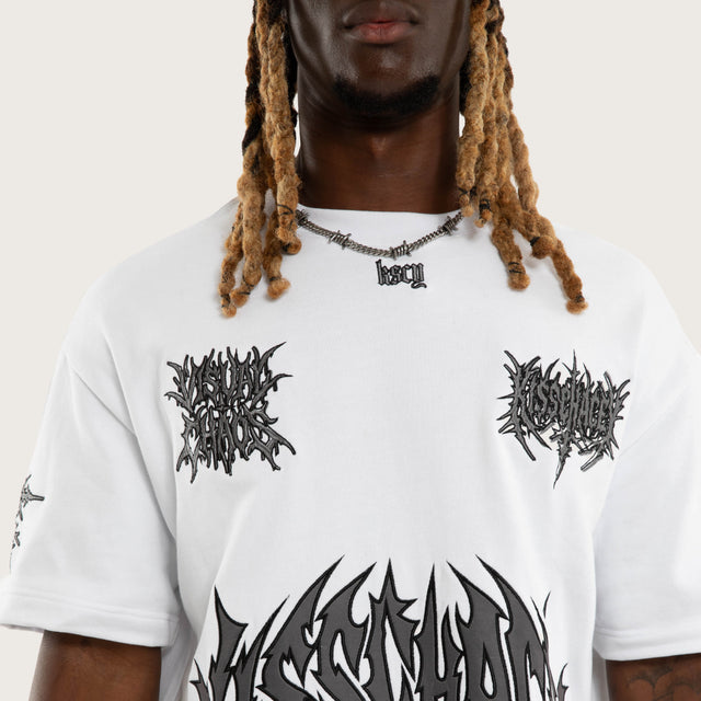 Model wears Goliath Loopback Street Tee Optical White T-Shirts White – image 4