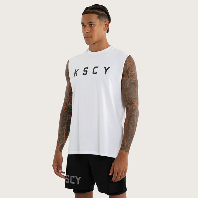 Model wears Vigor Split Hem Muscle in White | Kiss Chacey Activewear Muscle Tees in White - Image 3