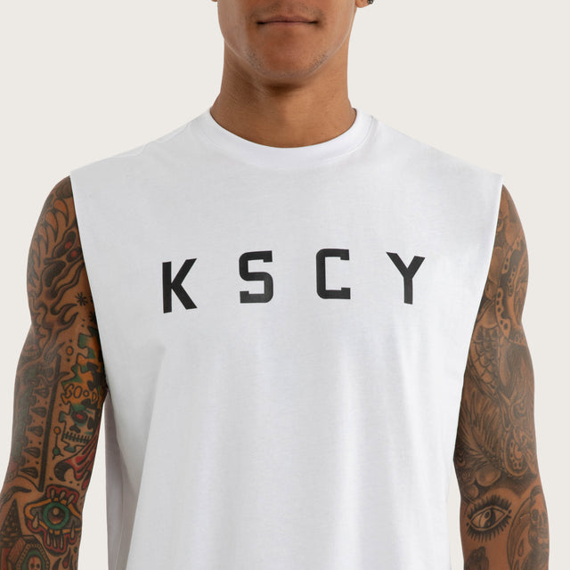 Model wears Vigor Split Hem Muscle in White | Kiss Chacey Activewear Muscle Tees in White - Image 4