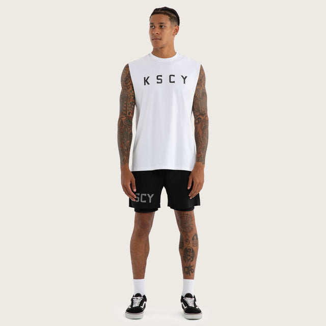 Model wears Vigor Split Hem Muscle in White | Kiss Chacey Activewear Muscle Tees in White - Image 5