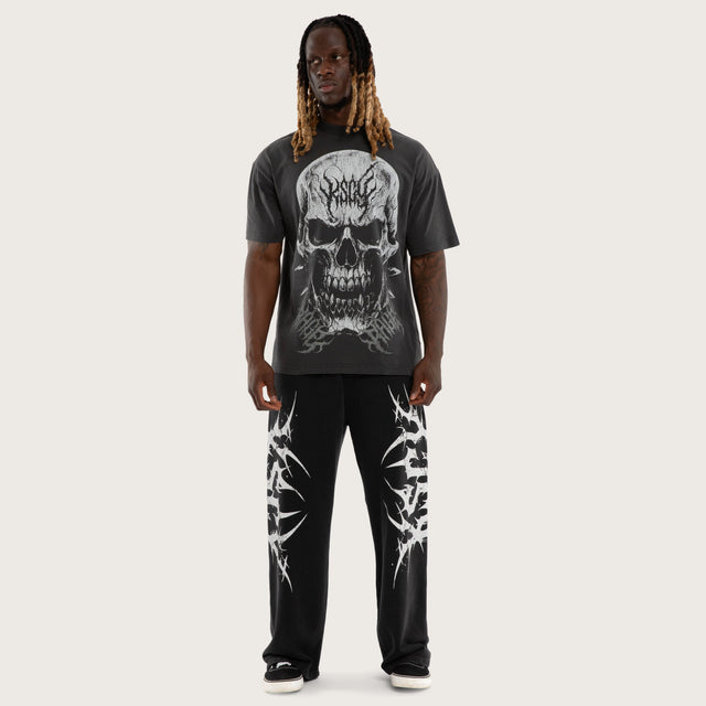 Model wears Creeper Pump Cover Raptor Tee Pigment Black T-Shirts Black – image 5