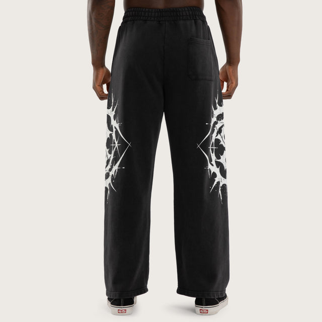 Model wears Chaotic Baggy Trackpant Black Trackpants Black – image 3