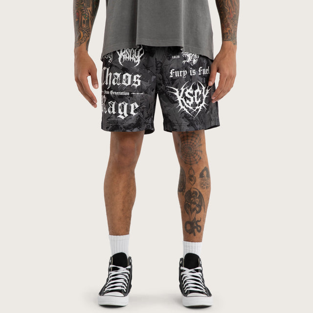 Model wears Chaos Rage Mesh Trackshort Dark Camo Activewear Trackpants in Camo - Image 2