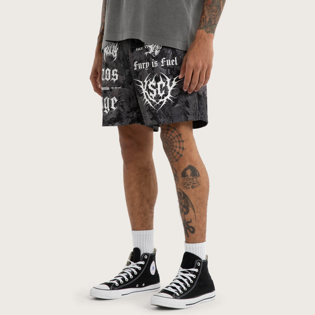 Model wears Chaos Rage Mesh Trackshort Dark Camo Activewear Trackpants in Camo - Image 1