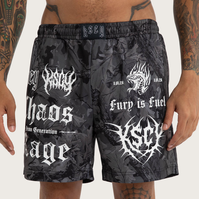 Model wears Chaos Rage Mesh Trackshort Dark Camo Activewear Trackpants in Camo - Image 3