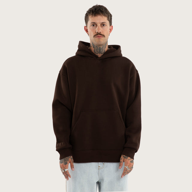 Model wears Weyburn Hoodie Dark Brown Hoodies in Brown - Image 8