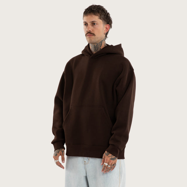 Model wears Weyburn Hoodie Dark Brown Hoodies in Brown - Image 7