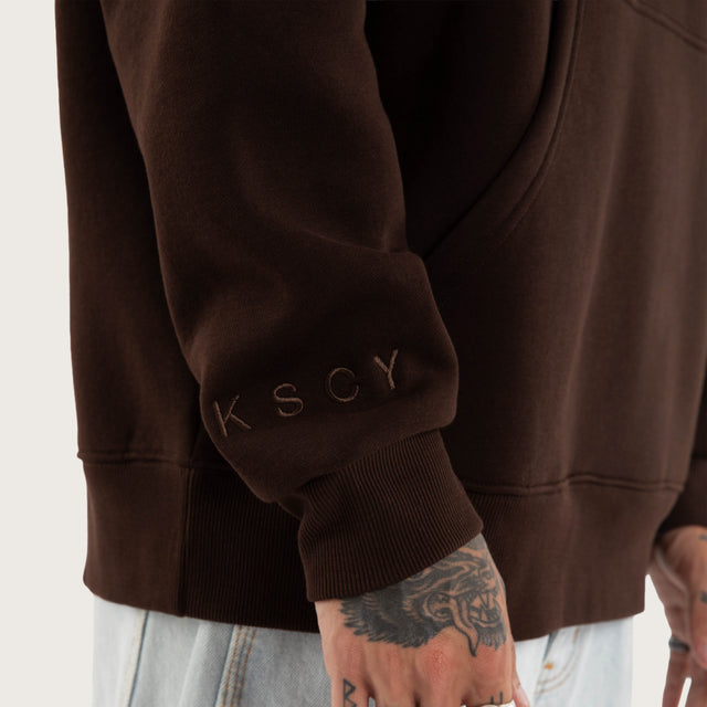 Model wears Weyburn Hoodie Dark Brown Hoodies in Brown - Image 3