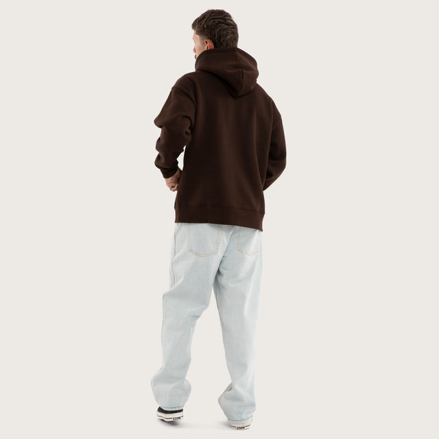 Model wears Weyburn Hoodie Dark Brown Hoodies in Brown - Image 5