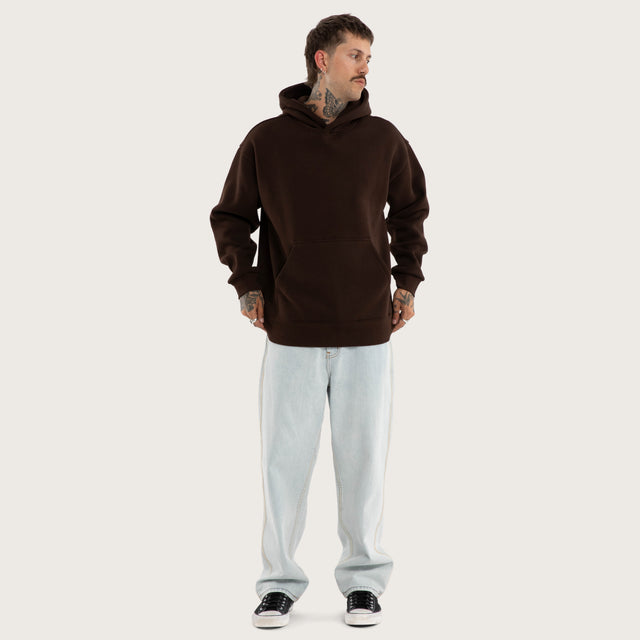 Model wears Weyburn Hoodie Dark Brown Hoodies in Brown - Image 6
