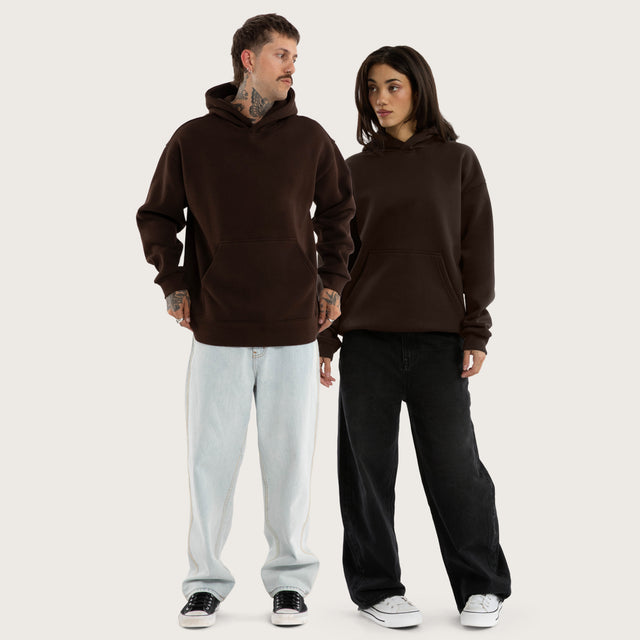 Model wears Weyburn Hoodie Dark Brown Hoodies in Brown - Image 9