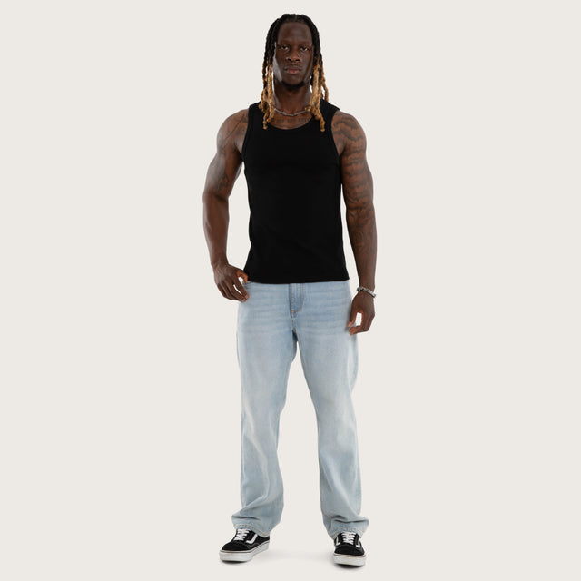 Model wears Weiza Waffle Cotton Singlet in Jet Black Tanks in Black - Image 5