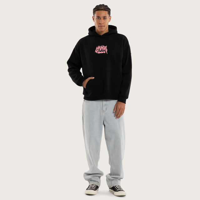 Model wears Melt Oversized Hoodie Jet Black Hoodies in Black - Image 5