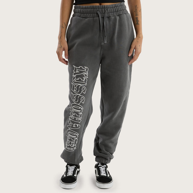 Model wears Genesis Trackpant Pigment Charcoal Trackpants in Grey - Image 5