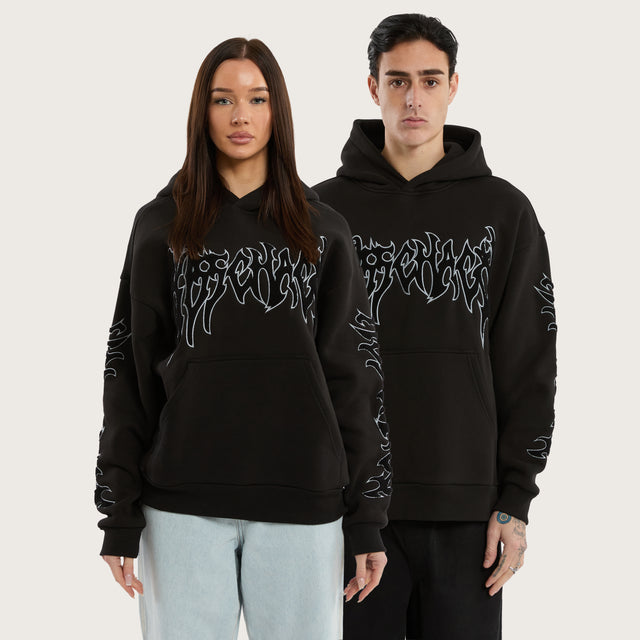 Model wears Scyth Relaxed Hoodie Jet Black Hoodies in Black - Image 1