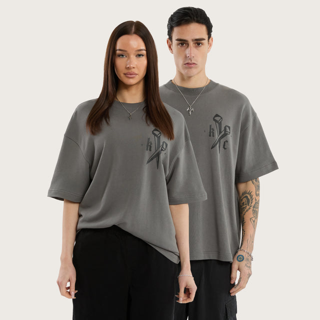 Model wears Nailed Loopback Street Tee Charcoal Grey T-Shirts in Grey - Image 1