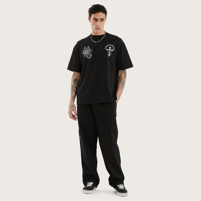 Model wears Sandtomb Heavyweight Box Fit Tee Jet Black T-Shirts in Black - Image 2